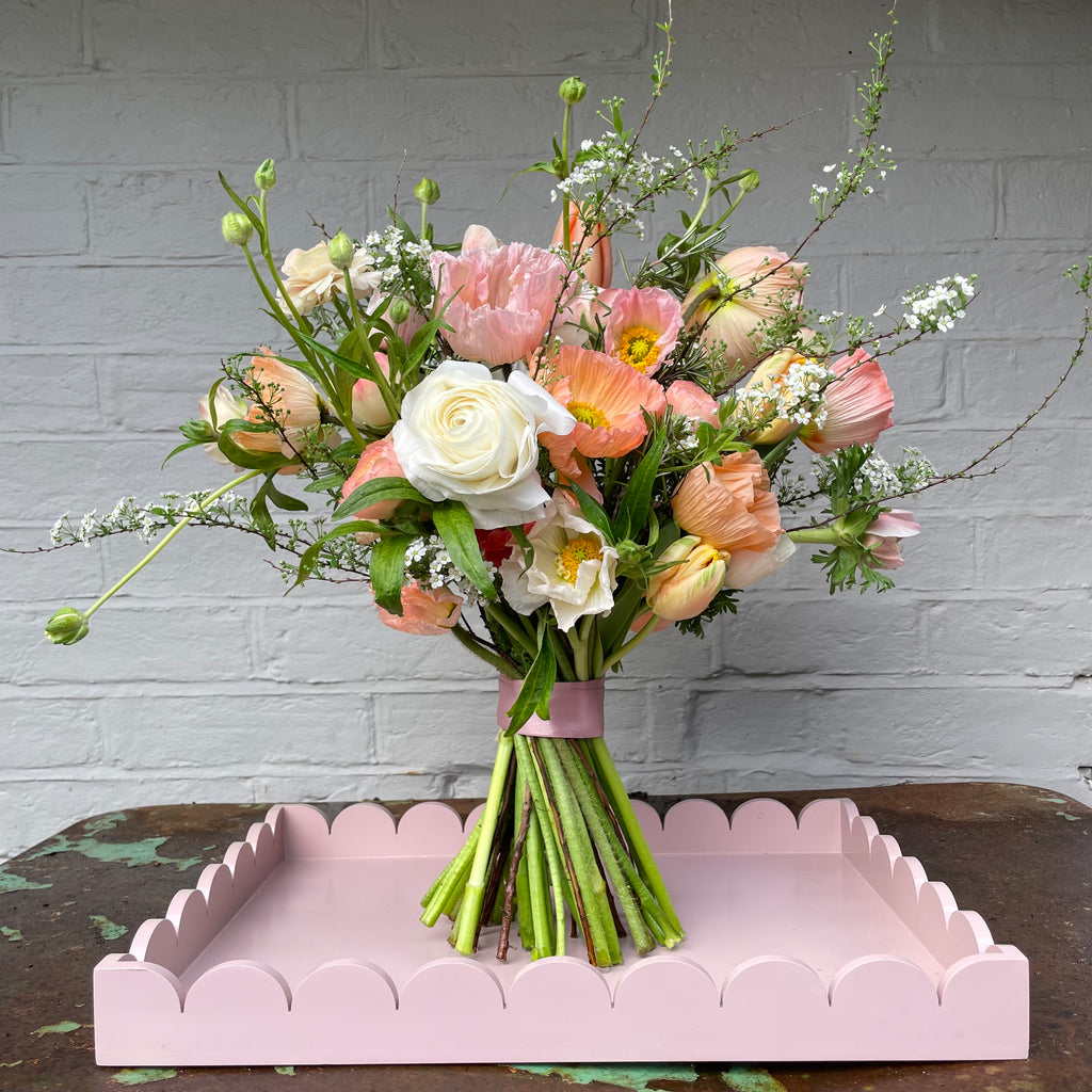 A BRIDE'S PALER BLOOMS