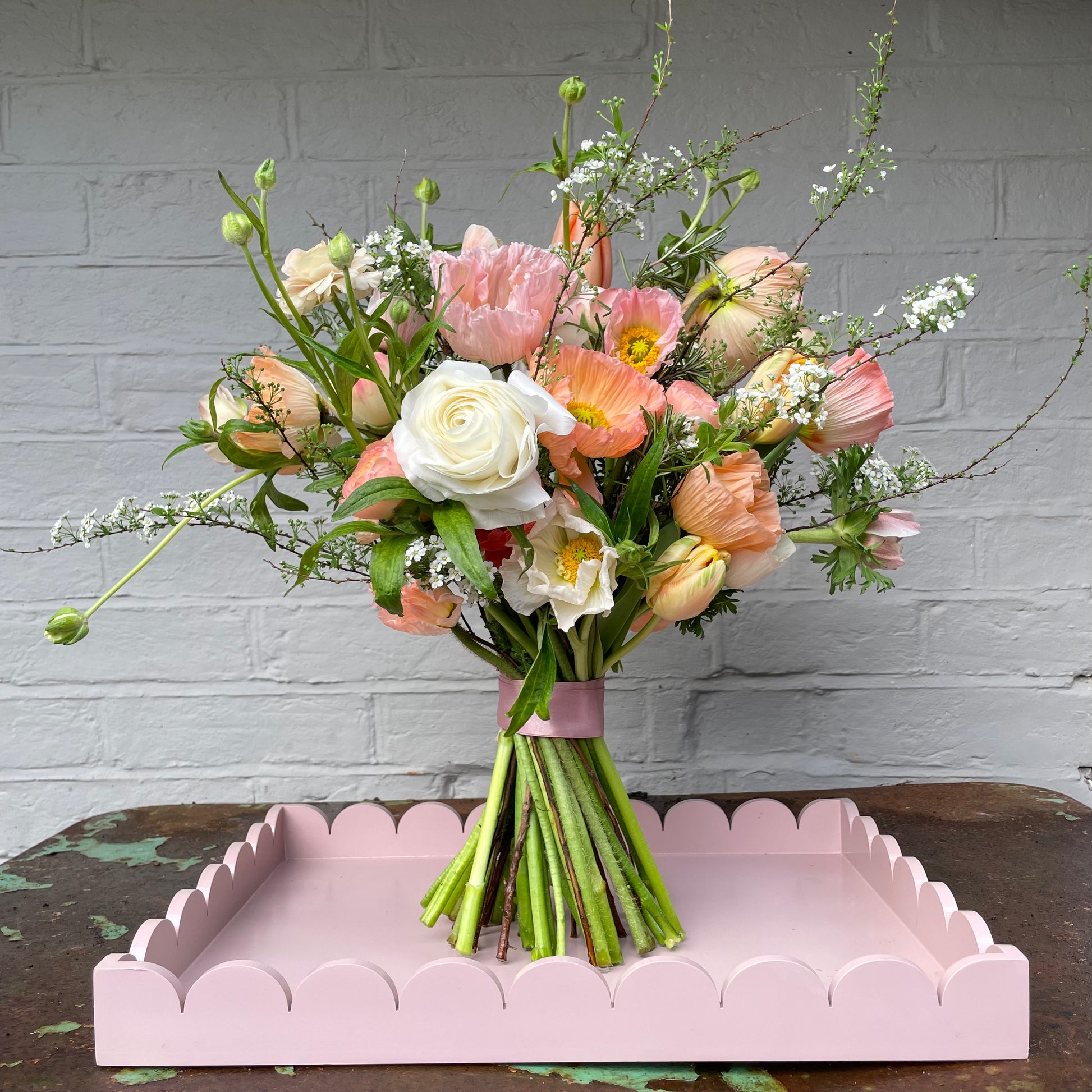 A BRIDE'S PALER BLOOMS